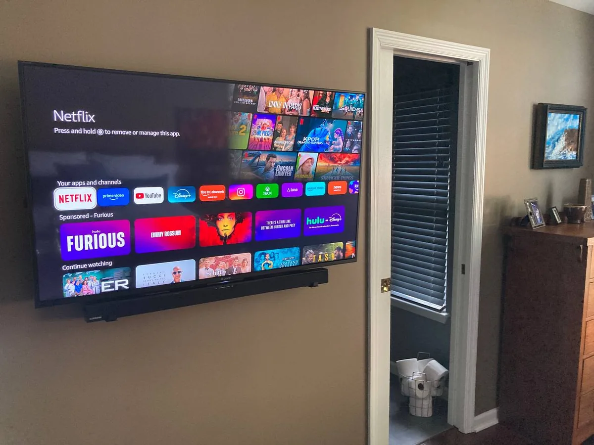 Sony Bravia bedroom TV installation with Samsung soundbar and Netflix smart setup