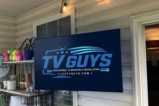 LG OLED TV mounted on a covered back porch with DirecTV, Wi-Fi connection, and programmed remotes